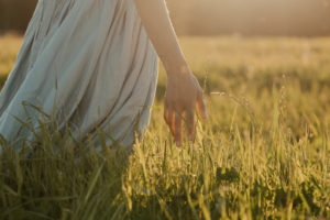 Woman in nature, illustrating the role nature is playing in the spa industry